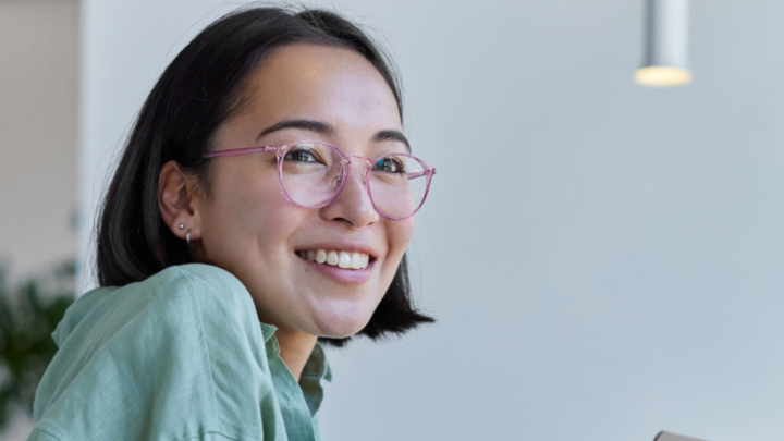 Smiling office worker wearing glasses